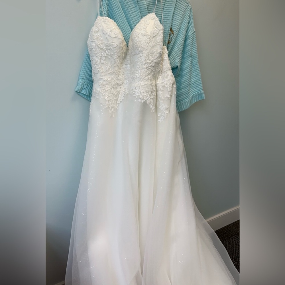 Brand new with tags unaltered wedding dress.
